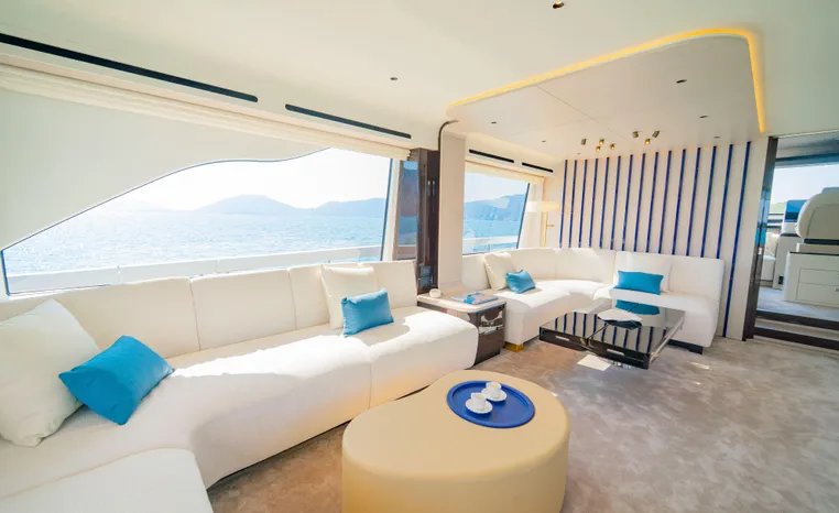 Luxurious interior of 2025 Azimut Fly 78 yacht with elegant seating and ocean view.